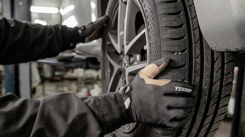 MTA registered mechanic inspecting a vehicle engine for warranty repairs